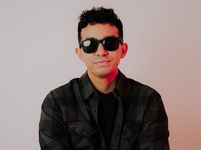 DJ Crave headshot in dark sunglasses