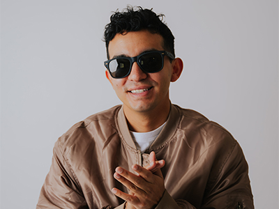 DJ Crave headshot in sunglasses and jacket