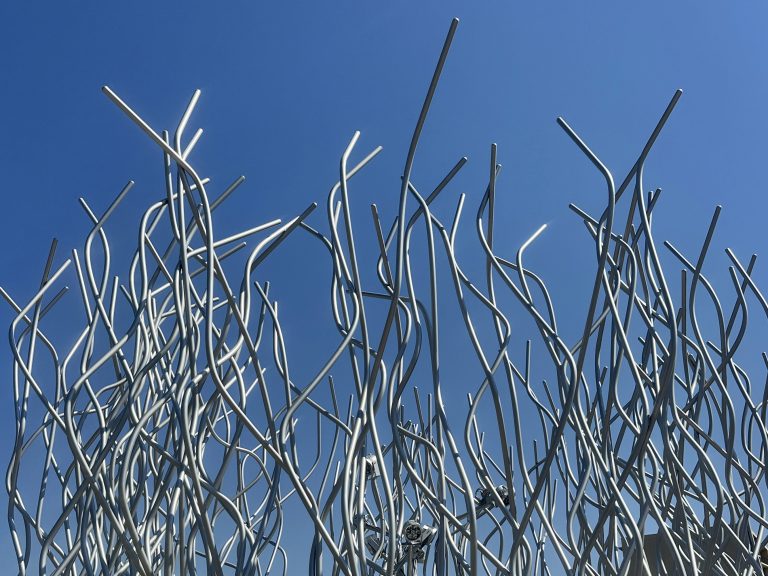 Sculpture of wavy metal poles